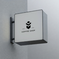 A professional outdoor square sign board mockup featuring a minimalist black coffee shop logo branding design