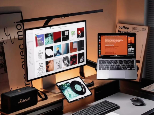 Modern creative workstation for video editors and designers featuring a multi-screen setup
