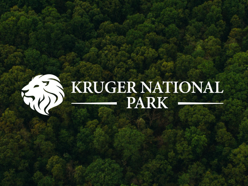 Kruger National Park official logo with a lion icon set against a background of lush green African wilderness trees.